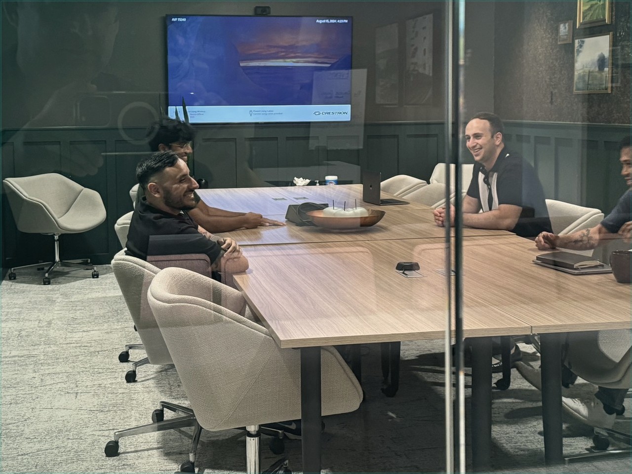 Amalgam team around a conference table shaping the plan on day one.